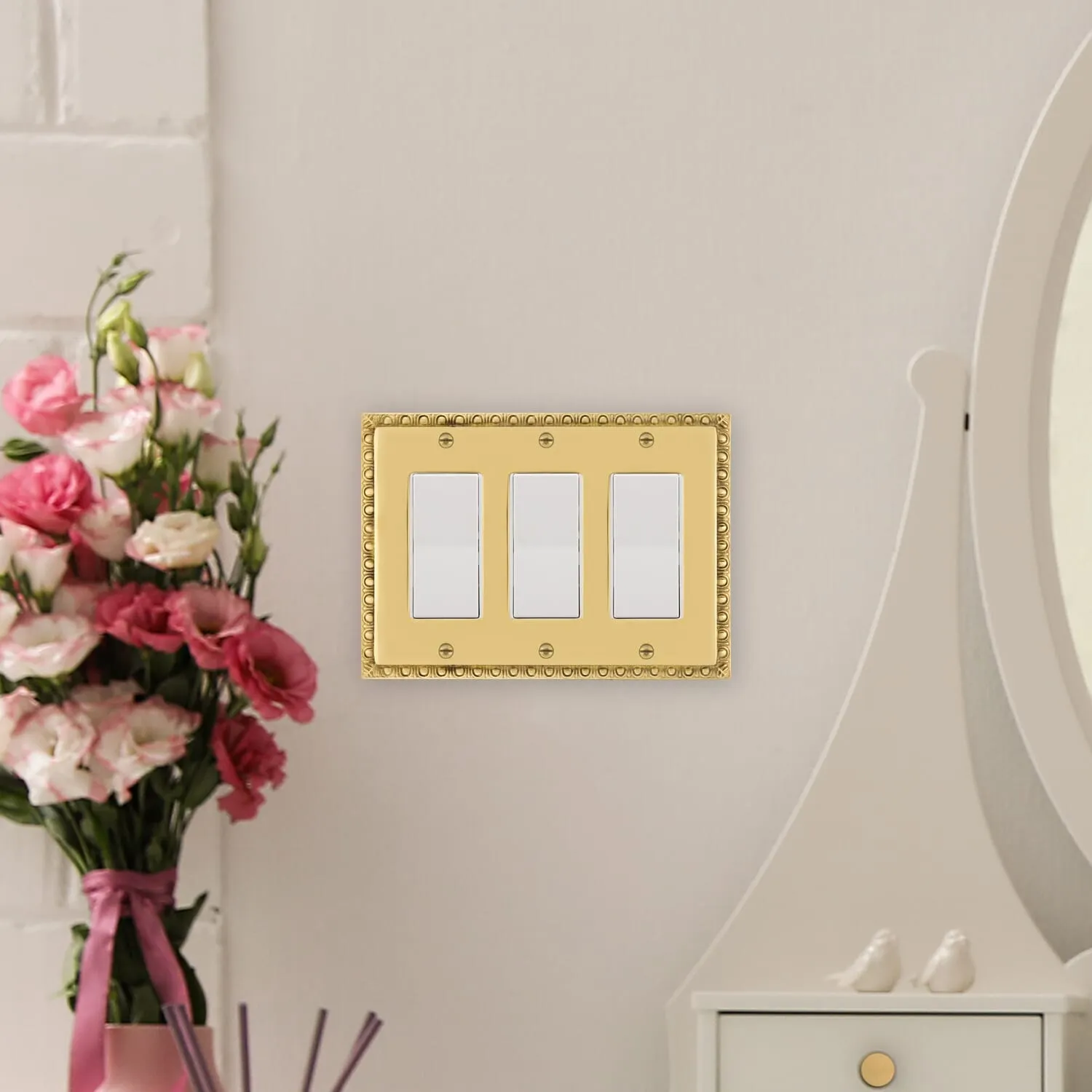 Egg & Dart Switch Plate with Triple Rocker in Polished Brass